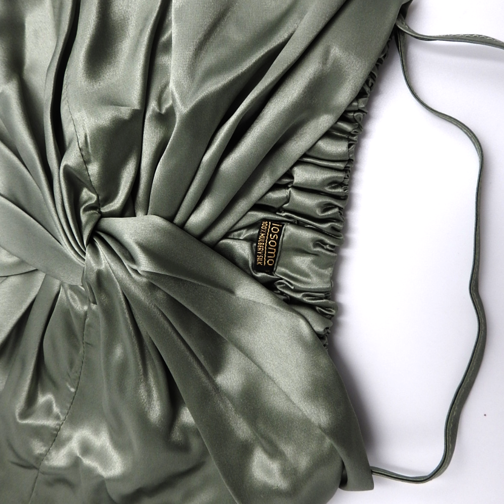 pistachio bonnet with a visible brand label on a white background