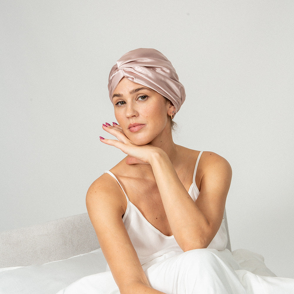 woman wearing a pink silk bonnet