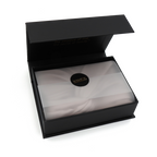 Black open box with a white interior and a visible brand logo on a white background