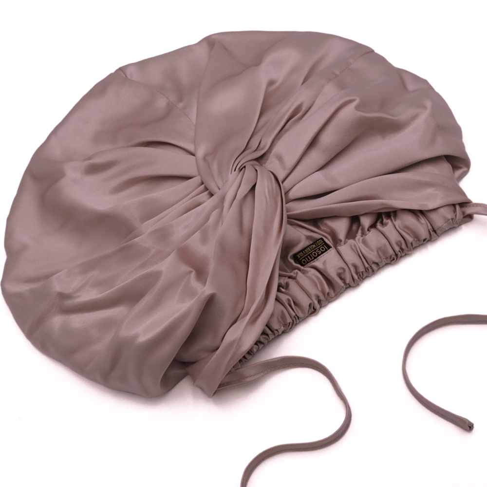 Pink bonnet on a white background