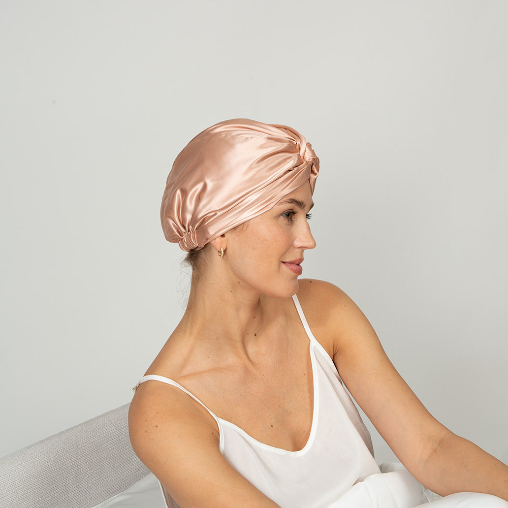 woman wearing a rose pink color bonnet