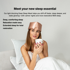 Woman wearing a rose gold silk sleep mask against a plain background