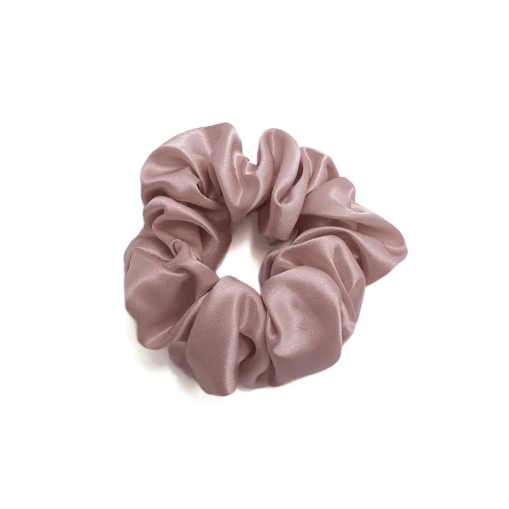Pink scrunchie on a white background