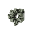 Green scrunchie on a white background