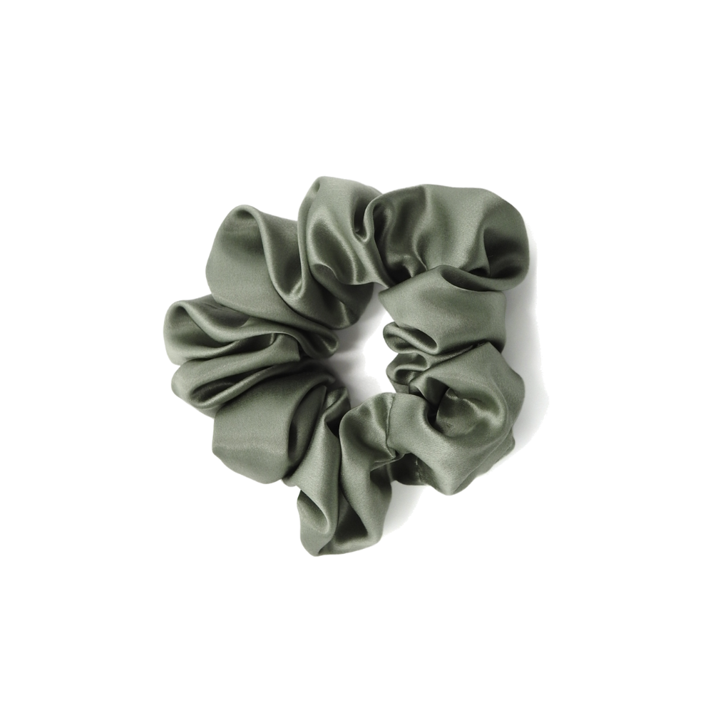 Green scrunchie on a white background