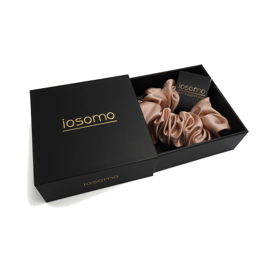 iosomo hair scrunchies in a black box on a white background